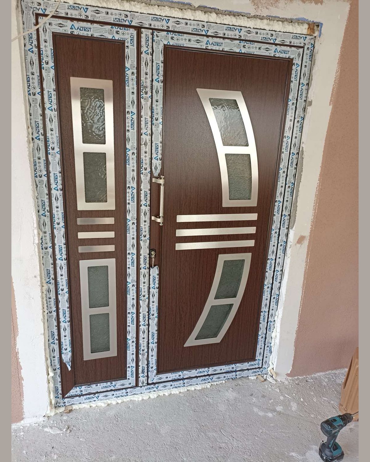 Double door with the SK14F panel in dark walnut and a matching sidelight, fitted in the opening