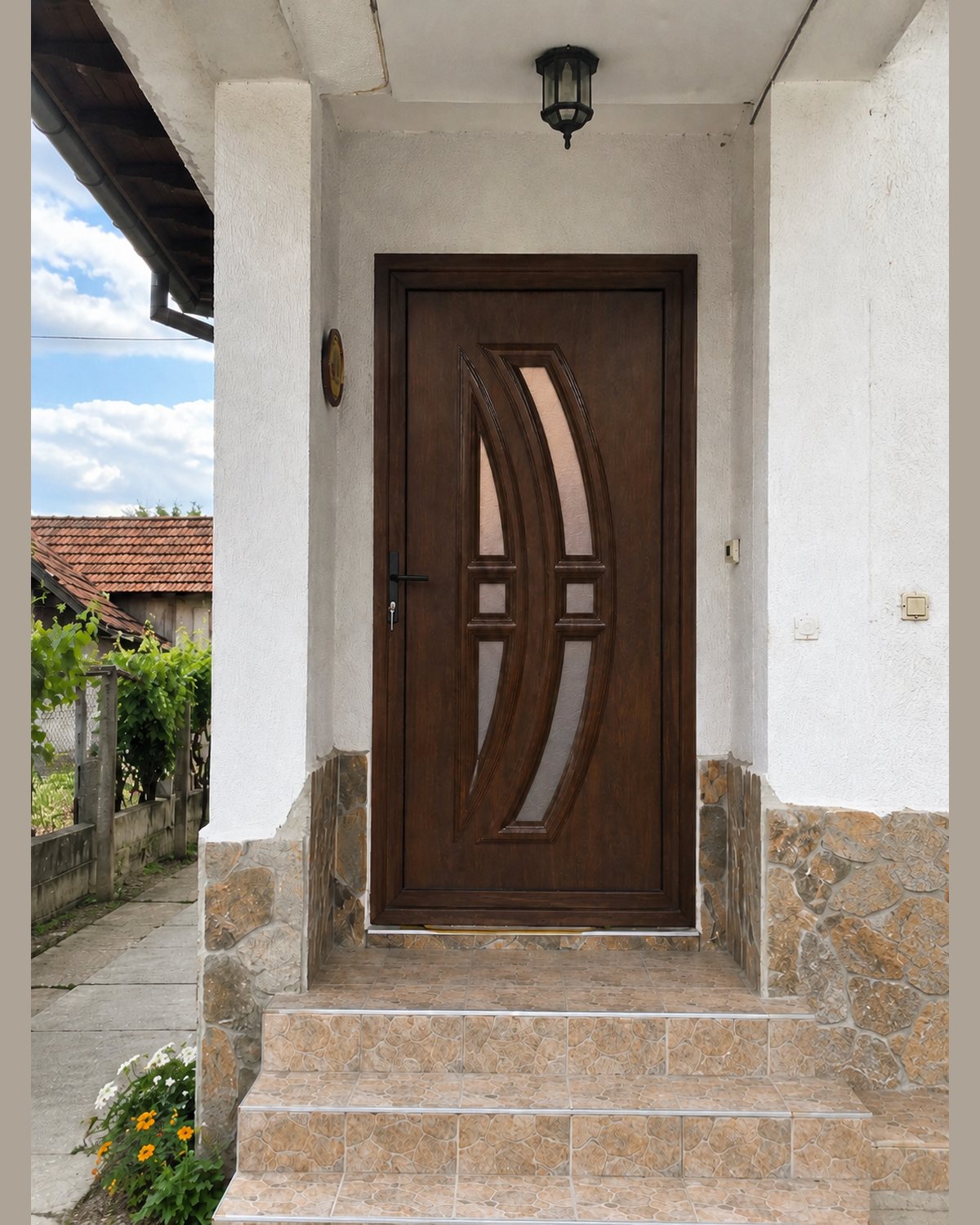 SK33T in dark walnut installed at the entrance of a house with a stone plinth