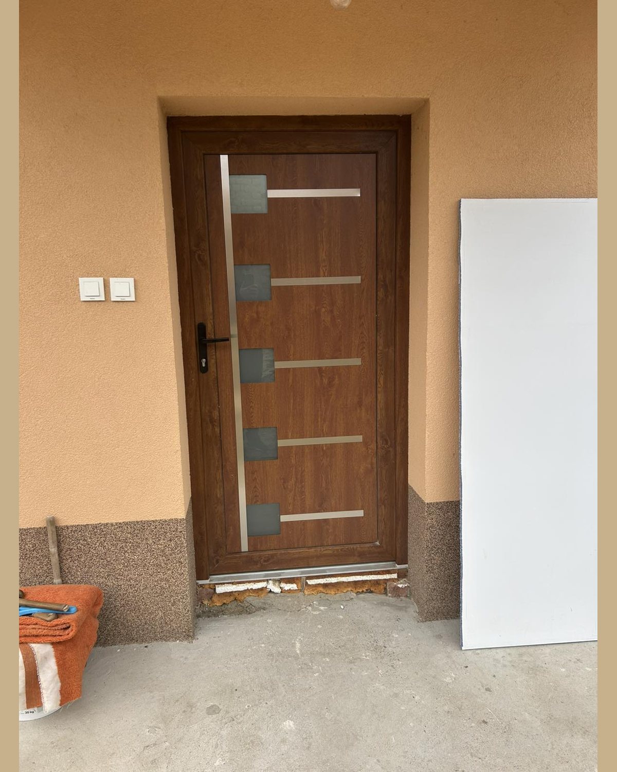 SK57F entrance door panel in golden oak installed on a newly built house